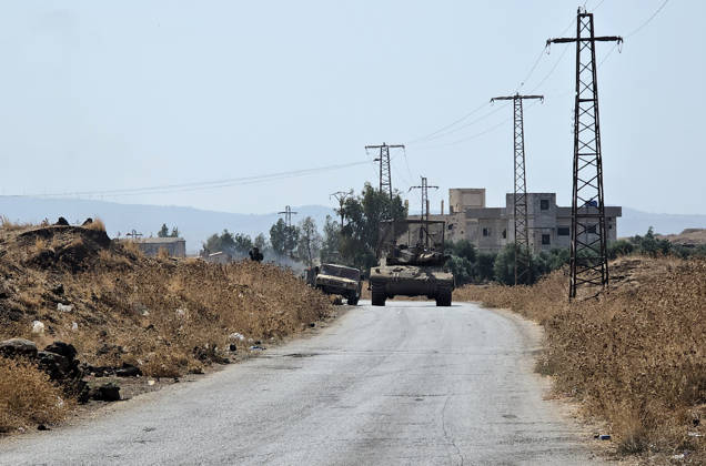 Israeli army conducts raids in Syria s Quneitra countryside QUNEITRA, SYRIA - OCTOBER 8: Israeli forces patrol the village with tanks as they conduct raids in residential areas and fire harassment shots at open areas in the countryside of Quneitra, southern Syria, on October 8, 2026. Huseyin Mesal Anadolu Quneitra Syria. Editorial use only. Please get in touch for any other usage.  Copyright: x2026xAnadoluxHuseyinxMesalx
