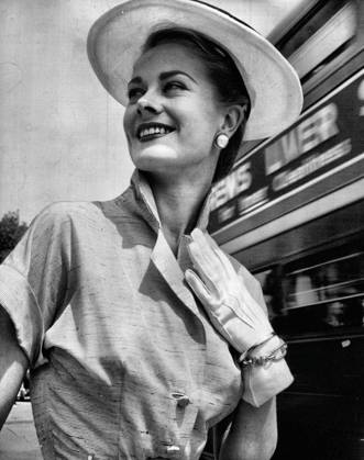 Nola Rose (Mrs. Antony Hunt), in an afternoon dress of silk tweed organza. Skirt is full. Nola wears shoes of the same fabric. April 28, 1955. (Photo by David Moore).  Copyright: xDavidxMoorex 5513-85305354
