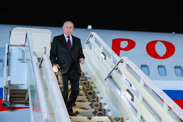 TURKMENISTAN, BALKAN PROVINCE - OCTOBER 8, 2026: Vladimir Putin, President of Russia, steps off his plane ahead of a meeting of the CIS (Commonwealth of Independent States) Council of Heads of State in Turkmenbasy. Vladimir Smirnov TASS  98954848