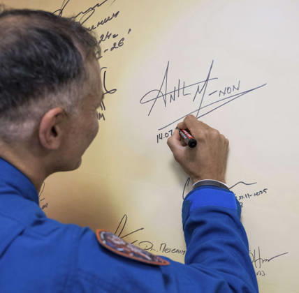 October 8, 2026, Baikonur, Kazakhstan: Baikonur, Kazakhstan. 14 July, 2026. NASA astronaut Anil Menon signs a mural at the Cosmonaut Hotel before departing for suit-up and launch, July 14, 2026 in Baikonur, Kazakhstan. Signing the mural is a preflight tradition. Baikonur Kazakhstan - ZUMAp138 20261008_zaa_p138_022 Copyright: xBillxIngalls Nasax