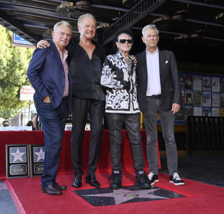 Pat Sajak, honorees Graham Russell, Russell Hitchcock and David Foster (L-R) pose during an unveiling ceremony honoring the rock duo Air Supply with the 2,859th star on the Hollywood Walk of Fame in Los Angeles on Thursday October 8, 2026.  LAP2026100807 JIMxRUYMEN
