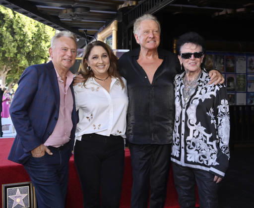 Russell Hitchcock (R) of the rock duo Air Supply is joined by Pat Sajak, his wife Lesley Brown and Hitchcocks wife Cari Hitchcock (L-R) during an unveiling ceremony honoring the duo with the 2,859th star on the Hollywood Walk of Fame in Los Angeles on Thursday October 8, 2026.  LAP2026100828 JIMxRUYMEN