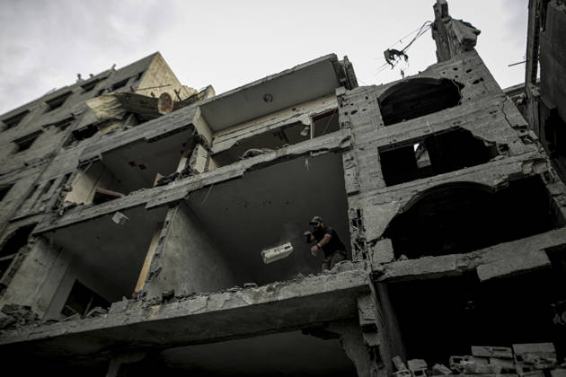 Israeli army continues its attacks on Gaza despite the ceasefire GAZA CITY, PALESTINE - OCTOBER 9: Palestinian civilians and emergency responders search through the debris of damaged residential buildings following an Israeli military airstrike in the Sabra neighborhood, south of Gaza City, Palestine on October 9, 2026. Multiple dead and wounded, including women and children, were reported as rescue teams worked under severe resource shortages to extract survivors from beneath destroyed structures. Saeed M. M. T. Jaras Anadolu Gaza City Gaza. Editorial use only. Please get in touch for any other usage.  Copyright: x2026xAnadoluxSaeedxM.xM.xT.xJarasx