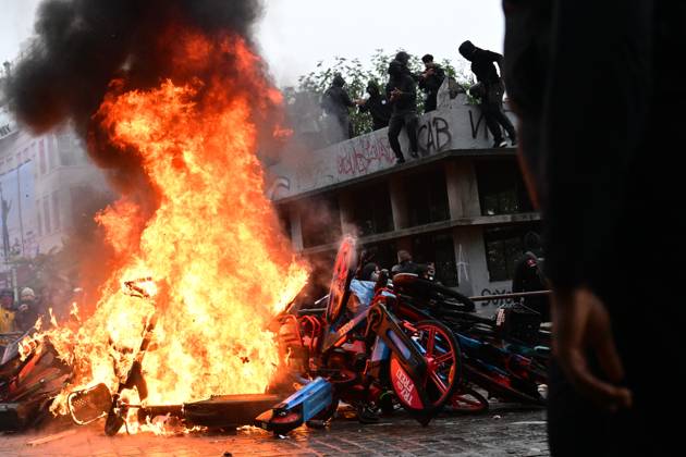 A fire of burning shared bikes pictured during a national manifestation against the Federal Government s budgetary measures, under the Keep your hands out of our pockets! (Blijf uit onze zakken! - Pas dans nos poches) moniker, organised by the trade unions on Friday 9 October 2026 in Brussels.  DIRKxWAEM 189239824