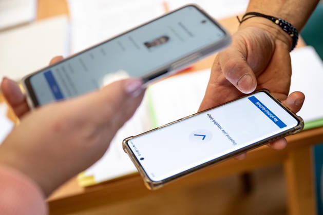 The two-day elections to municipal assemblies started in the Czech Republic together with the first round of the elections to one-third of the Senate, on October 9, 2026. On the photo a voter identifies himself at a polling station using the eDoklady app (digital ID copy) on his mobile phone before casting his vote in Hradec Kralove. (CTKxPhoto DavidxTanecek) CTKPhotoP2026100905620  CTKPhotoP2026100905620