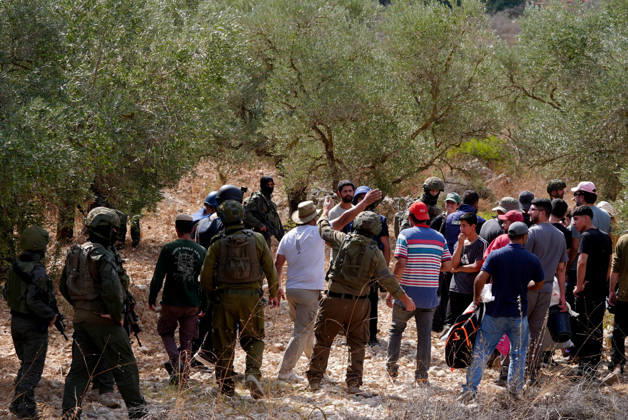 Clashes erupt between Israeli settlers and Palestinian farmers in West Bank RAMALLAH, WEST BANK - OCTOBER 9: Clashes break out between Israeli settlers, accompanied by Israeli soldiers, and Palestinian farmers harvesting olives in the town of Deir Ibzi, near Ramallah in West Bank, on October 9, 2026. The incident reportedly involved damage to olive crops and provocative actions by the settlers. Issam Rimawi Anadolu West Bank Palestine. Editorial use only. Please get in touch for any other usage.  Copyright: x2026xAnadoluxIssamxRimawix