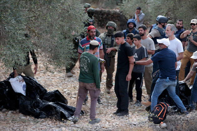 Clashes erupt between Israeli settlers and Palestinian farmers in West Bank RAMALLAH, WEST BANK - OCTOBER 9: Clashes break out between Israeli settlers, accompanied by Israeli soldiers, and Palestinian farmers harvesting olives in the town of Deir Ibzi, near Ramallah in West Bank, on October 9, 2026. The incident reportedly involved damage to olive crops and provocative actions by the settlers. Issam Rimawi Anadolu Ramallah West Bank. Editorial use only. Please get in touch for any other usage.  Copyright: x2026xAnadoluxIssamxRimawix