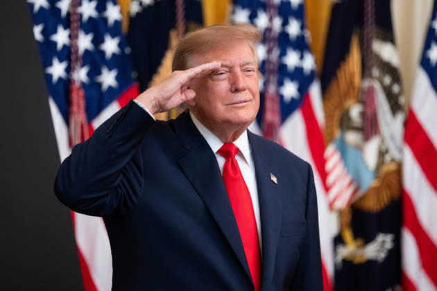 October 9, 2026, Washington, District Of Columbia, USA: United States President Donald J Trump salutes during the national anthem as he hosts a Columbus Day Celebration in the East Room of the White House in Washington, DC, USA on Friday, October 8, 2026 Washington USA - ZUMAs152 20261009_faa_s152_033 Copyright: xAaronxSchwartz-PoolxviaxCNPx