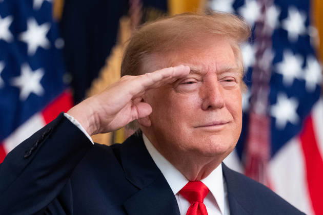 October 9, 2026, Washington, District Of Columbia, USA: United States President Donald J Trump salutes during the national anthem as he hosts a Columbus Day Celebration in the East Room of the White House in Washington, DC, USA on Friday, October 8, 2026 Washington USA - ZUMAs152 20261009_faa_s152_037 Copyright: xAaronxSchwartz-PoolxviaxCNPx