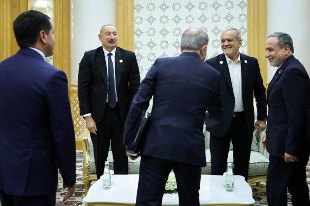October 9, 2026, Turkmenbashi, Turkmenistan: Azerbaijani President Ilham Aliyev, left, and Iranian President Masoud Pezeshkian, right, stand with members of their delegations before a bilateral meeting in Turkmenbashi, Turkmenistan, on October 9, 2026. According to Azerbaijan s presidency, the leaders reviewed recent bilateral contacts and a recent visit by an Azerbaijani delegation to Iran, said work on the Aghband-Kalaleh project had reached its final stage and discussed follow-up on agreements from their previous meeting in Bishkek. Aliyev also noted Iran s first participation as a non-member state in the CIS Plus format. Turkmenbashi Turkmenistan - ZUMAi98_ 20261009_zih_i98_087 Copyright: xIranianxPresidencyx