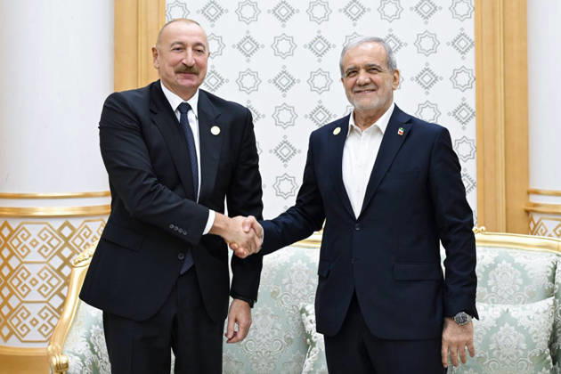 October 9, 2026, Turkmenbashi, Turkmenistan: Azerbaijani President Ilham Aliyev, left, and Iranian President Masoud Pezeshkian pose for photographs while shaking hands during their bilateral meeting in Turkmenbashi, Turkmenistan, on October 9, 2026. According to Azerbaijan s presidency, the leaders reviewed recent bilateral contacts and a recent visit by an Azerbaijani delegation to Iran, said work on the Aghband-Kalaleh project had reached its final stage and discussed follow-up on agreements from their previous meeting in Bishkek. Aliyev also noted Iran s first participation as a non-member state in the CIS Plus format. Turkmenbashi Turkmenistan - ZUMAi98_ 20261009_zih_i98_095 Copyright: xIranianxPresidencyx