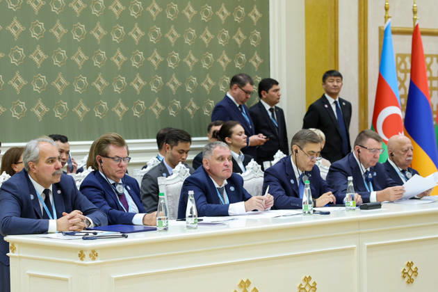 October 9, 2026, Turkmenbashi, Turkmenistan: Delegation members sit at a side table beneath national flags during the CIS Council of Heads of State meeting in the Avaza National Tourist Zone in Turkmenbashi, Turkmenistan, on October 9, 2026. The meeting, chaired by Turkmen President Serdar Berdimuhamedov, brought together leaders of CIS states and CIS Secretary General Sergey Lebedev, with Pezeshkian participating for the first time as a special guest. Turkmenbashi Turkmenistan - ZUMAi98_ 20261009_zih_i98_070 Copyright: xIranianxPresidencyx
