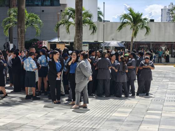 (261009) -- PANAMA CITY, Oct. 9, 2026 -- People gather outside following an earthquake in Panama City, Panama, Oct. 9, 2026. A major earthquake struck Panama on Friday. ) PANAMA-PANAMA CITY-EARTHQUAKE LixJiaxu 