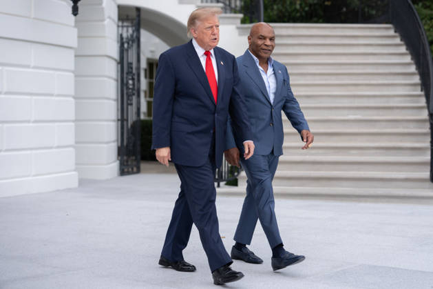 President Donald Trump walks with former professional boxer Mike Tyson on the South Lawn of the White House before boarding Marine One in Washington, DC on Friday, Oct. 9, 2026. Trump is heading to Syracuse on Friday to boost Republican gubernatorial candidate Bruce Blakeman, who is trailing Governor Kathy Hochul in polls ahead of November s election.  WASP20261009142 AaronxSchwartz