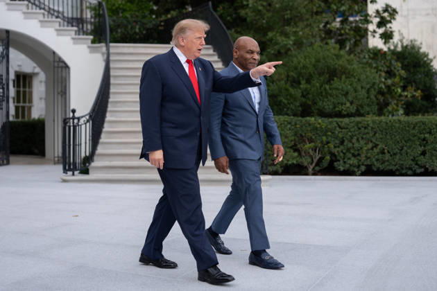 President Donald Trump walks with former professional boxer Mike Tyson on the South Lawn of the White House before boarding Marine One in Washington, DC on Friday, Oct. 9, 2026. Trump is heading to Syracuse on Friday to boost Republican gubernatorial candidate Bruce Blakeman, who is trailing Governor Kathy Hochul in polls ahead of November s election.  WASP20261009143 AaronxSchwartz