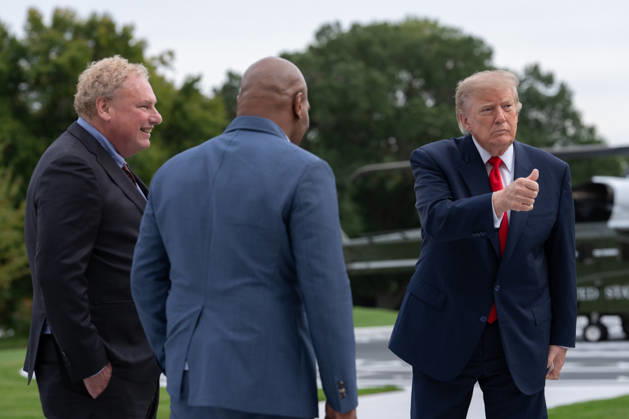 President Donald Trump gives a thumbs up as he and president of the New York yankees Randy Levine and former professional boxer Mike Tyson walk on the South Lawn of the White House before boarding Marine One in Washington, DC on Friday, Oct. 9, 2026. Trump is heading to Syracuse on Friday to boost Republican gubernatorial candidate Bruce Blakeman, who is trailing Governor Kathy Hochul in polls ahead of November s election.  WASP20261009158 AaronxSchwartz