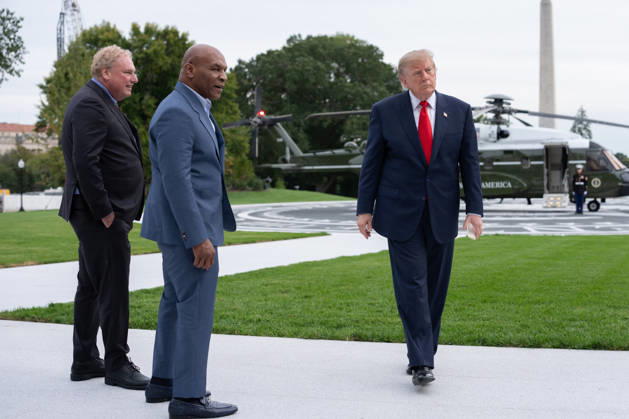 President Donald Trump walks with former professional boxer Mike Tyson and owner of the New York Yankees Randy Levine on the South Lawn of the White House before boarding Marine One in Washington, DC on Friday, Oct. 9, 2026. President Donald Trump is heading to Syracuse on Friday to boost Republican gubernatorial candidate Bruce Blakeman, who is trailing Governor Kathy Hochul in polls ahead of November s election.  WASP20261009160 AaronxSchwartz