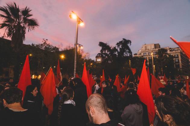 October 9, 2026, Barcelona, Catalonia, Spain: Protesters hold red flags at dusk in Placa Universitat. More than a thousand people gathered in Placa Universitat in Barcelona on the evening of October 9, 2026, at a housing rights protest called by tenants and housing unions, including the Sindicat de Llogateres, under the slogan For Olga and Maricarmen: the housing business kills . The protest honoured MARICARMEN, an 87-year-old woman who died in a Madrid hospital on October 7, two weeks after being evicted from the rented flat where she had lived since 1956, and OLGA, a woman from L Hospitalet de Llobregat who took her own life after being evicted. The unions are calling a general strike for housing on November 11, 2026. Barcelona Spain - ZUMAs392 20261009_zip_s392_002 Copyright: xFabianxSuspensivox