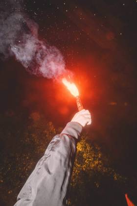 October 9, 2026, Barcelona, Catalonia, Spain: A protester holds up a lit flare during the march. More than a thousand people gathered in Placa Universitat in Barcelona on the evening of October 9, 2026, at a housing rights protest called by tenants and housing unions, including the Sindicat de Llogateres, under the slogan For Olga and Maricarmen: the housing business kills . The protest honoured MARICARMEN, an 87-year-old woman who died in a Madrid hospital on October 7, two weeks after being evicted from the rented flat where she had lived since 1956, and OLGA, a woman from L Hospitalet de Llobregat who took her own life after being evicted. The unions are calling a general strike for housing on November 11, 2026. Barcelona Spain - ZUMAs392 20261009_zip_s392_004 Copyright: xFabianxSuspensivox