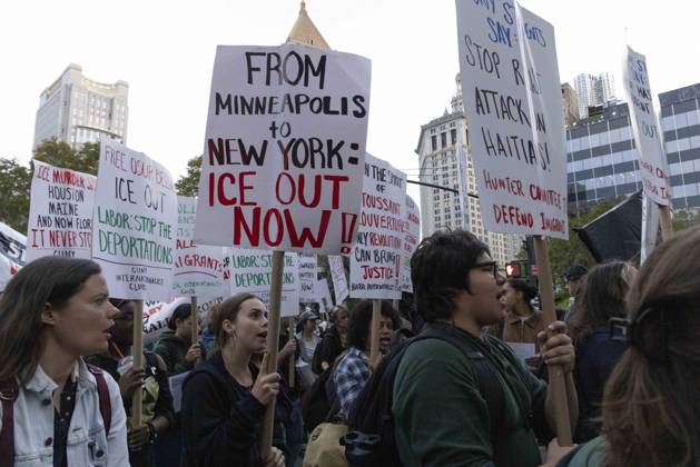 October 9, 2026, New York, New York, USA: Demonstrators march through the streets of Lower Manhattan holding signs that read CUNY STUDENTS SAY STOP RACIST ATTACK ON HAITIANS! FROM MINNEAPOLIS to NEW YORK ICE OUT NOW! at the Hands Off NYC coalition emergency protest demanding justice the day following ICE shooting a Bronx man while his 5 year child was in the car. New York USA  - ZUMAr174 20261009_znp_r174_035 Copyright: xGinaxMxRandazzox