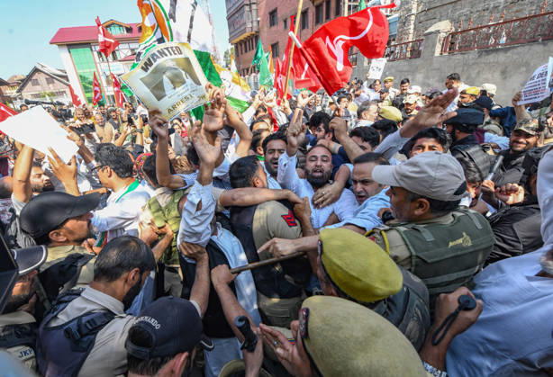 October 10, 2026, Srinagar, Jammu And Kashmir, India: Police personnel try to stop supporters of the opposition alliance INDIA bloc (Indian National Developmental Inclusive Alliance) during a protest demanding the resignation of India s Chief Election Commissioner Gyanesh Kumar over alleged voter roll irregularities linked to the special intensive revision (SIR), in Srinagar on October 10, 2026. Srinagar India  - ZUMAz120 20261010_zip_z120_003 Copyright: xBasitxZargarx