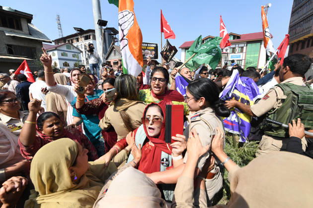 October 10, 2026, Srinagar, Jammu And Kashmir, India: Police personnel try to stop supporters of the opposition alliance INDIA bloc (Indian National Developmental Inclusive Alliance) during a protest demanding the resignation of India s Chief Election Commissioner Gyanesh Kumar over alleged voter roll irregularities linked to the special intensive revision (SIR), in Srinagar on October 10, 2026. Srinagar India  - ZUMAz120 20261010_zip_z120_013 Copyright: xBasitxZargarx