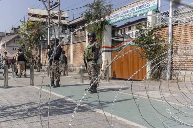 October 10, 2026, Srinagar, Jammu And Kashmir, India: Security forces personnel stand guard outside Congress Bhawan as INDIA bloc alliance partners stage a protest under the Save Democracy Week and Vote Bachao, Desh Bachao campaign, amid row over the resignation of Chief Election Commissioner Gyanesh Kumar in Srinagar, the capital city of Indian Kashmir. Srinagar India  - ZUMAf191 20261010_zip_f191_001 Copyright: xUmarxFarooqx