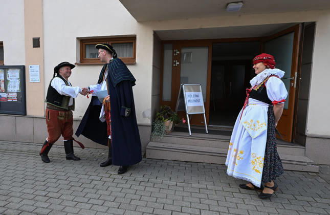 The two-day elections to municipal assemblies continued in the Czech Republic together with the first round of the elections to one-third of the Senate, on October 10, 2026. On the photo voters wearing traditional Hana folk costumes cast their ballots in Kozusany-Tazaly, in the Olomouc Region. (CTKxPhoto LudekxPerina) CTKPhotoP2026101001714  CTKPhotoP2026101001714