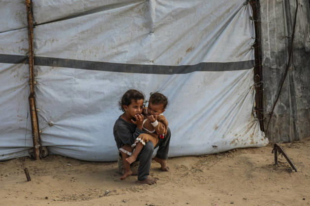 Palestinians still lack basic necessities amid Israel attacks DEIR AL BALAH, GAZA, PALESTINE - OCTOBER 10: Palestinians living in tents set up in the Bureij area carry water in containers to their makeshift shelters in Deir al Balah, Gaza, Palestine on October 10, 2026.The humanitarian crisis in the region continues to deepen, with thousands of displaced families struggling to survive without access to the most basic necessities. Adam Bilal Anadolu Deir al Balah Gaza. Editorial use only. Please get in touch for any other usage.  Copyright: x2026xAnadoluxAdamxBilalx