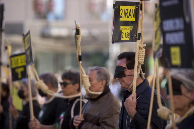 October 10, 2026, Madrid, Madrid, Spain: Protesters with signs and nooses around their necks during a rally at Callao Square in central Madrid. World Day Against the Death Penalty has been observed every October 10th since 2003. Madrid Spain  - ZUMAs296 20261010_znp_s296_003 Copyright: xLuisxSotox