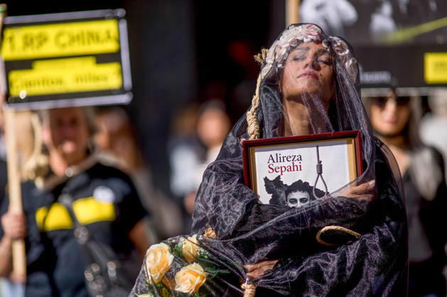 October 10, 2026, Madrid, Spain: A woman holds a portrait, wearing a veil on her head during a rally against the death penalty in Callao Square in central Madrid. World Day Against the Death Penalty has been observed every October 10th since 2003. Madrid Spain - ZUMAs197 20261010_aaa_s197_022 Copyright: xLuisxSotox