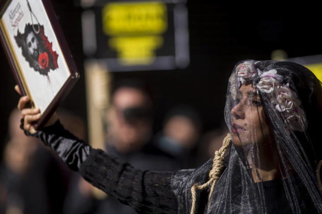 October 10, 2026, Madrid, Spain: A woman holds a portrait, wearing a veil on her head during a rally against the death penalty in Callao Square in central Madrid. World Day Against the Death Penalty has been observed every October 10th since 2003. Madrid Spain - ZUMAs197 20261010_aaa_s197_025 Copyright: xLuisxSotox