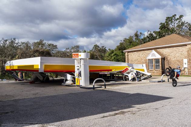 October 10, 2026, Gulf Shores, Fl, USA: A child rides his bike past a Shell gas station that collapsed after Hurricane Isaias came ashore..Hurricane Isaias made landfall Friday, October 9 along the U.S. Gulf coast. Gulf Shores USA  - ZUMAs197 20261010_aaa_s197_027 Copyright: xJenxGolbeckx
