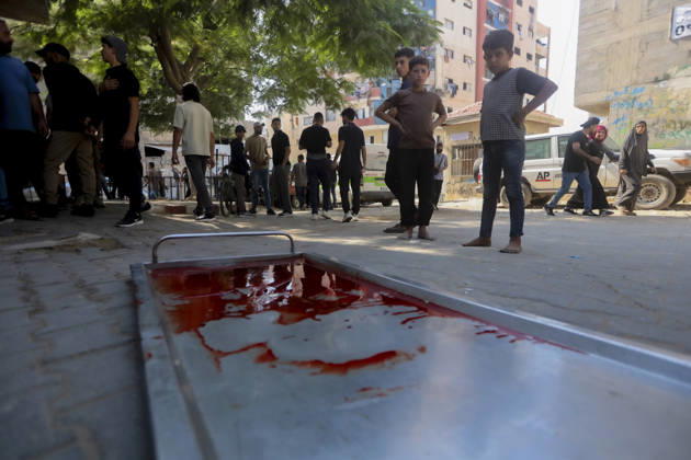 Gaza Palestine Airstrike Aftermath Children look at a stretcher filled with blood outside Al-Shifa Hospital in Gaza City, Palestine on October 10, 2026. Four Palestinians were killed in an air strike near Panda Mall, and people carried the victims toward Al-Shifa Hospital for funeral prayers. Gaza Gaza Strip Palestinian Territories Copyright: xIbrahimxZanounx