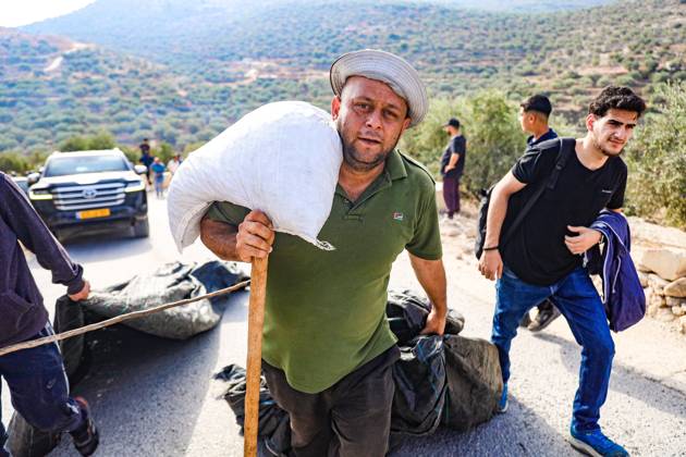 October 10, 2026, Ramallah: DEIR ABU MASHÃ¢â‚¬â ¢AL, PALESTINE Ã¢â‚¬ OCTOBER 10, 2026: Palestinian farmers came under attack by Israeli settlers and Israeli forces as they headed to harvest olives on their land in Deir Abu MashÃ¢â‚¬â ¢al, northwest of Ramallah. The event marked the villageÃ¢â‚¬â ¢s first olive harvest gathering of the new season. The Palestine Red Crescent Society reported that its teams treated nine people injured during the incident. The injuries included one caused by live ammunition to the thigh, two caused by rubber-coated metal bullets, and six resulting from physical assault. One of those struck by a rubber-coated metal bullet was photojournalist Issam Al-Rimawi. The incident occurred during the annual olive harve - ZUMAq101 20261010_zna_q101_051 Copyright: xSalmanxMohsenxAlkhatibx