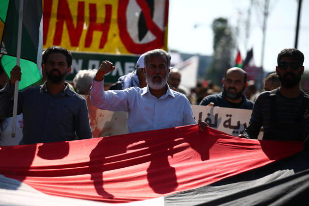 October 10, 2026, Athens, Attica, GREECE: Protesters chant and raise their fists while carrying a large Palestinian flag during a pro-Palestinian march. Athens GREECE  - ZUMAx103 20261010_zip_x103_007 Copyright: xHarrisxXanthopoulosx