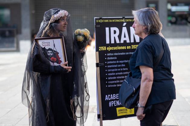 October 10, 2026, Madrid, Spain: Two women talk during a demonstration in Madrid..Gathering at Madrid s Puerta del Sol to speak out against the death penalty...World Day Against the Death Penalty has been observed every October 10th since 2003, an initiative promoted by the World Coalition Against the Death Penalty. This day brings together activists, international organizations, legal experts, and human rights defenders to call for the universal abolition of capital punishment. Madrid Spain  - ZUMAs197 20261010_aaa_s197_083 Copyright: xDavidxCanalesx