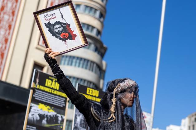 October 10, 2026, Madrid, Spain: A woman dressed in black as a sign of protest takes part in a demonstration in Madrid..Gathering at Madrid s Puerta del Sol to speak out against the death penalty...World Day Against the Death Penalty has been observed every October 10th since 2003, an initiative promoted by the World Coalition Against the Death Penalty. This day brings together activists, international organizations, legal experts, and human rights defenders to call for the universal abolition of capital punishment. Madrid Spain  - ZUMAs197 20261010_aaa_s197_084 Copyright: xDavidxCanalesx