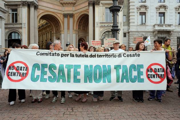 October 10, 2026, Milan, Italy: MILAN, ITALY Ã¢â‚¬ OCTOBER 10, 2026: Protesters gather for a sit-in in Piazza della Scala in central Milan to oppose the development of new data centers across Lombardy and Italy. The demonstration is organized by the Rete dei Comitati No Data Center (No Data Center Committee Network), which is calling for a moratorium on permits for new facilities. The group also urges public authorities to conduct thorough environmental, urban planning and regional assessments before approving projects. For approved facilities that have not yet begun operating, campaigners are calling for reviews to be reopened if potential microclimate effects and cumulative impacts with existing facilities were not adequately assessed.  - ZUMAq101 20261010_zna_q101_178 Copyright: xCalogeroxRussox