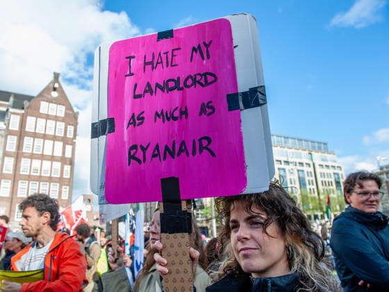 October 10, 2026, Amsterdam, North Holland, Netherlands: A protester is holding a placard against her landlord during the demonstration. People gathered against the worsening housing crisis. Under the motto Houses for people, not for profit, they demand fundamental changes in Dutch public housing. Amsterdam Netherlands  - ZUMAs197 20261010_aaa_s197_556 Copyright: xAnaxFernandezx