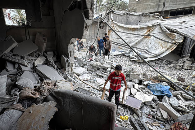 Palestinians Inspect Damage After Strike in Deir al-Balah Palestinians inspect their belongings amid the rubble of damaged residential buildings and their displacement tents after an Israeli airstrike targeted a house in Deir al-Balah, in the central Gaza Strip, on October 11, 2026. Photo by Ahmed Ibrahim apaimages Deir al-Balah Gaza Palestinian Territory 111026_Deir_al-Balah_AI_00(16) Copyright: xapaimagesxAhmedxIbrahimx xapaimagesx