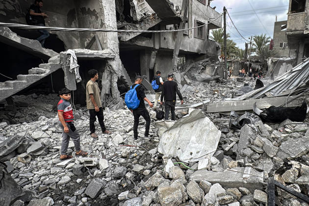 Palestinians Inspect Damage After Strike in Deir al-Balah Palestinians inspect their belongings amid the rubble of damaged residential buildings and their displacement tents after an Israeli airstrike targeted a house in Deir al-Balah, in the central Gaza Strip, on October 11, 2026. Photo by Ahmed Ibrahim apaimages Deir al-Balah Gaza Palestinian Territory 111026_Deir_al-Balah_AI_00(20) Copyright: xapaimagesxAhmedxIbrahimx xapaimagesx