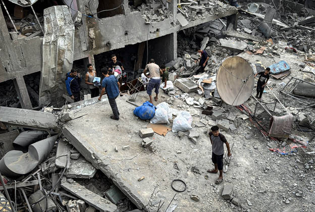 Palestinians Inspect Damage After Strike in Deir al-Balah Palestinians inspect their belongings amid the rubble of damaged residential buildings and their displacement tents after an Israeli airstrike targeted a house in Deir al-Balah, in the central Gaza Strip, on October 11, 2026. Photo by Ahmed Ibrahim apaimages Deir al-Balah Gaza Palestinian Territory 111026_Deir_al-Balah_AI_00(4) Copyright: xapaimagesxAhmedxIbrahimx xapaimagesx