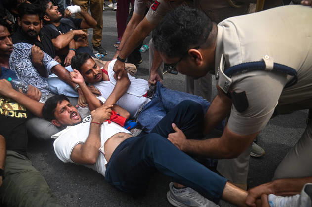 October 11, 2026, New Delhi, Delhi, India: Security personnel detain protestors during a protest seeking the resignation of India s Chief Election Commissioner Gyanesh Kumar, over alleged electoral malpractices in the Special Intensive Revision (SIR) of electoral rolls, in New Delhi, India on October 11, 2026. New Delhi India - ZUMAj168 20261011_zip_j168_018 Copyright: xKabirxJhangianix