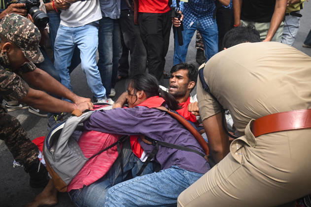 October 11, 2026, New Delhi, Delhi, India: Security personnel detain protestors during a protest seeking the resignation of India s Chief Election Commissioner Gyanesh Kumar, over alleged electoral malpractices in the Special Intensive Revision (SIR) of electoral rolls, in New Delhi, India on October 11, 2026. New Delhi India - ZUMAj168 20261011_zip_j168_019 Copyright: xKabirxJhangianix