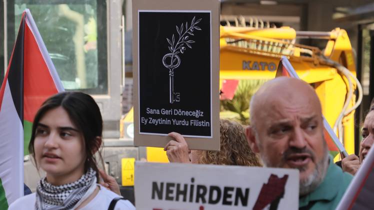 October 11, 2026, Â°Zmir, ToÂ¼rkiye: IZMIR, TURKEY, OCTOBER 11, 2026: Pro-Palestinian demonstrators gather outside the Turkan Saylan Cultural Center in Izmir during a protest organized by the local branch of the Association for the Freedom of Palestinians. Participants condemn Israeli military operations in Gaza and criticize US support for Israel, calling attention to Palestinian civilian casualties since October 7, 2023. The demonstration concludes at Gundogdu Square, where participants throw carnations into the sea in remembrance of Palestinians killed during the conflict. Â°Zmir Türkiye - ZUMAq101 20261011_zna_q101_103 Copyright: xTurgayxKilicx