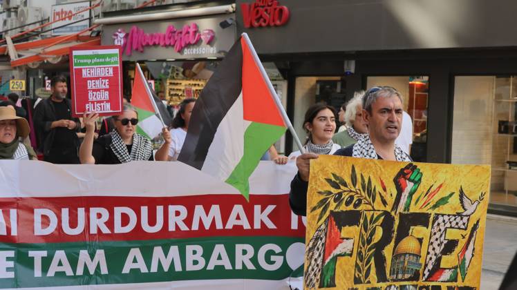 October 11, 2026, Â°Zmir, ToÂ¼rkiye: IZMIR, TURKEY, OCTOBER 11, 2026: Pro-Palestinian demonstrators gather outside the Turkan Saylan Cultural Center in Izmir during a protest organized by the local branch of the Association for the Freedom of Palestinians. Participants condemn Israeli military operations in Gaza and criticize US support for Israel, calling attention to Palestinian civilian casualties since October 7, 2023. The demonstration concludes at Gundogdu Square, where participants throw carnations into the sea in remembrance of Palestinians killed during the conflict. Â°Zmir Türkiye - ZUMAq101 20261011_zna_q101_111 Copyright: xTurgayxKilicx