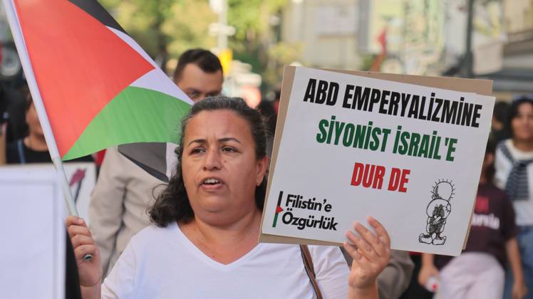 October 11, 2026, Â°Zmir, ToÂ¼rkiye: IZMIR, TURKEY, OCTOBER 11, 2026: Pro-Palestinian demonstrators gather outside the Turkan Saylan Cultural Center in Izmir during a protest organized by the local branch of the Association for the Freedom of Palestinians. Participants condemn Israeli military operations in Gaza and criticize US support for Israel, calling attention to Palestinian civilian casualties since October 7, 2023. The demonstration concludes at Gundogdu Square, where participants throw carnations into the sea in remembrance of Palestinians killed during the conflict. Â°Zmir Türkiye - ZUMAq101 20261011_zna_q101_114 Copyright: xTurgayxKilicx