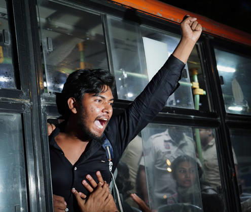 Police detain SFI members ahead of their planned Tiranga March at Connaught Place New Delhi, Oct 11 (ANI): A member of the Students™ Federation of India (SFI) raises slogans after being detained by Police ahead of their planned Tiranga March at Connaught Place, in New Delhi on Sunday. New Delhi Delhi India Copyright: xANIx ANI_20261011436