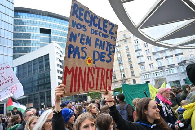 Tens of thousands march in Brussels demanding stronger climate action BRUSSELS, BELGIUM - OCTOBER 11: Demonstrators hold climate-themed placards as tens of thousands of people march through Brussels calling for stronger action against climate change and reduced dependence on fossil fuels, on October 11, 2026 in Brussels, Belgium. The protest was organized by the Belgian Climate Coalition, which brings together around 100 civil society organizations. Participants marched along major roads toward Schuman Square, home to several European Union institutions, while protesting the government s climate policies. Dursun Aydemir Anadolu Brussels Belgium. Editorial use only. Please get in touch for any other usage. Copyright: x2026xAnadoluxDursunxAydemirx